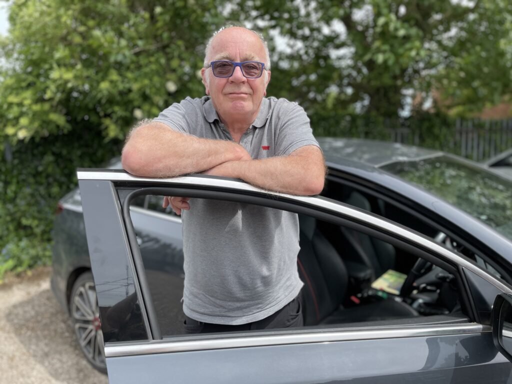 Image of a volunteer in a car for Medicar Service. 